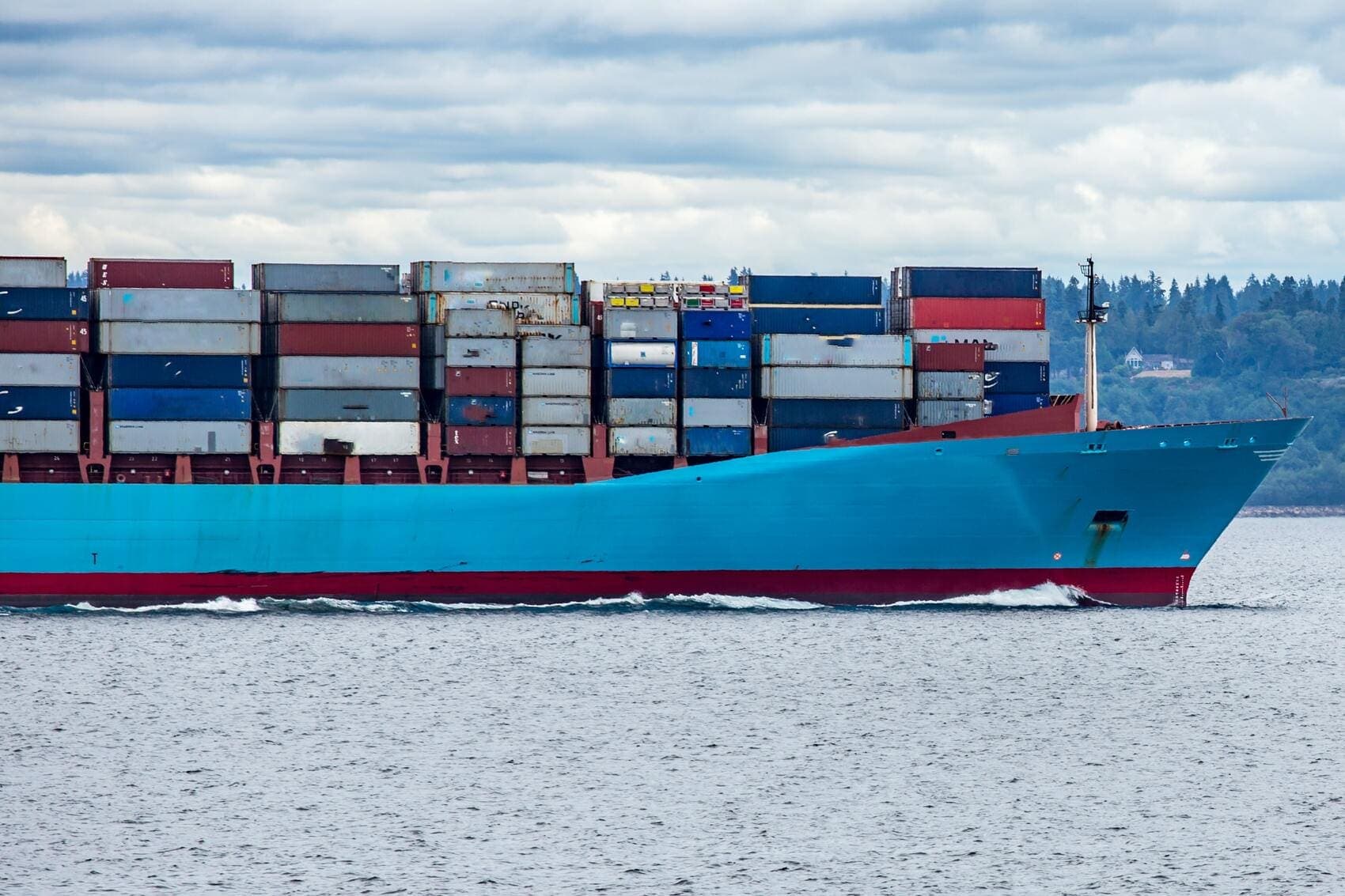 A fully loaded container ship under way.
